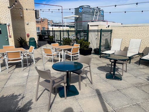 A patio with tables and chairs is set up.