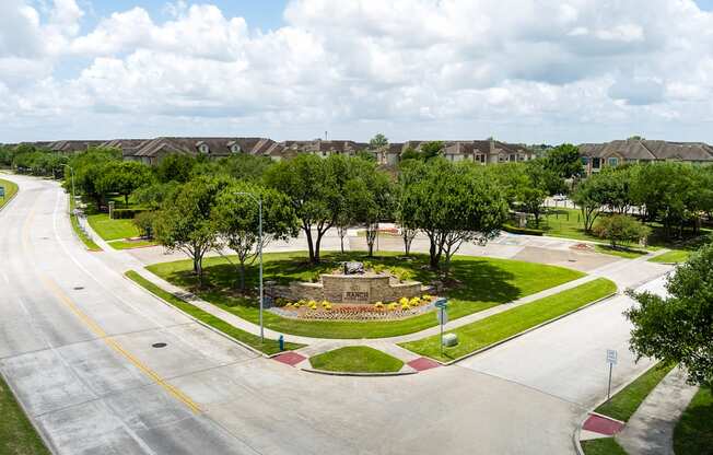 A road with a yellow line on the side and a sign on the right side.