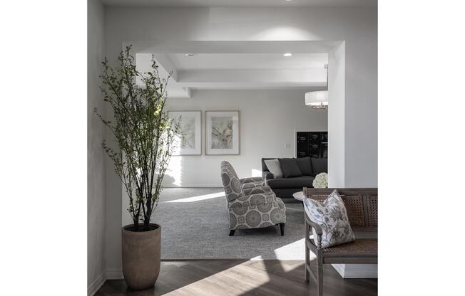 a living room filled with furniture and vase