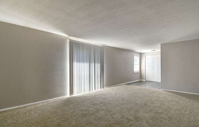 Living and dining room in a 2-bed, 1-bath apartment at Ashton Brook, featuring an open layout.
