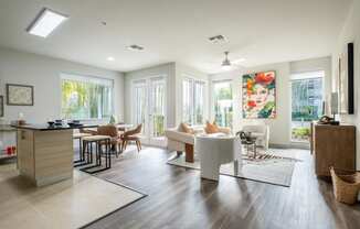 Reveal Heathrow apartments spacious living area with floor to ceiling windows