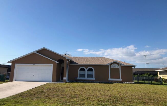 Experience this 4 bedroom 2 bath SW Cape Coral Single Family Home with Fenced in Yard.