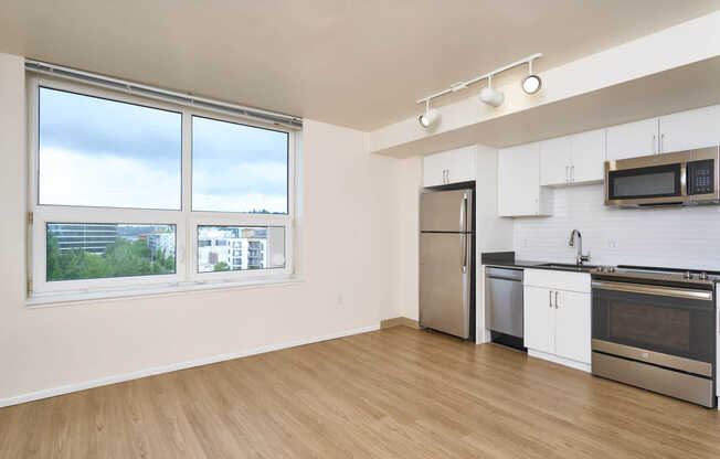 Studio and Kitchen with Stainless Steel Appliances