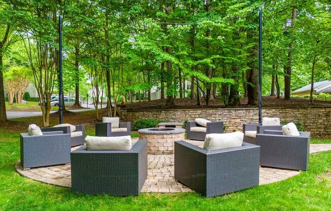 A set of outdoor furniture is arranged on a lawn.