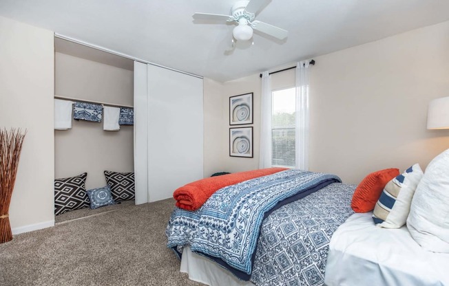Bedroom with cozy bed and lampat Royal Wildewood Manor Apartments, Clute