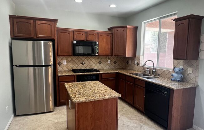 Spacious 4-Bedroom Mountains Edge Home with Downstairs Suite, Balcony & Covered Patio