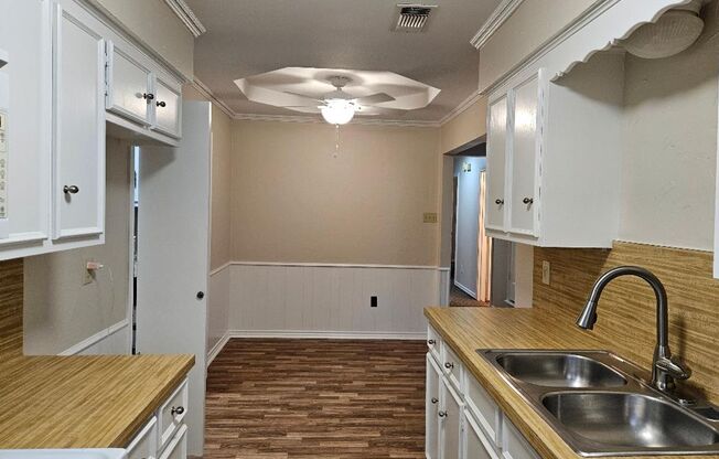 Three bedroom and two bathroom nicely remodeled with new flooring. Large wood fenced backyard