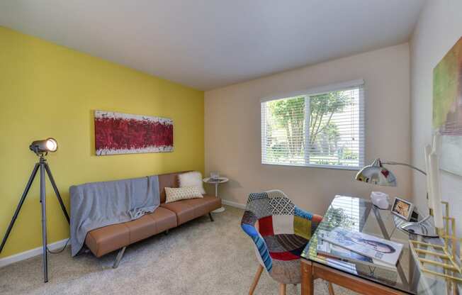 Guest Bedroom with Desk, Brown Sofa, Carpet and Window at Monte Bello Apartments, California, 95826