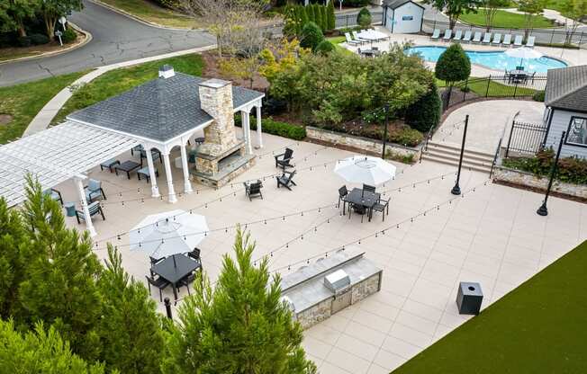 arial view of a patio with tables and umbrellas at View at Lake Lynn, Raleigh