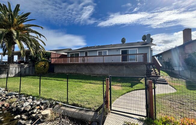 WATERFRONT HOME IN BEL MARIN KEYS WITH BOAT DOCK, FENCED YARD.