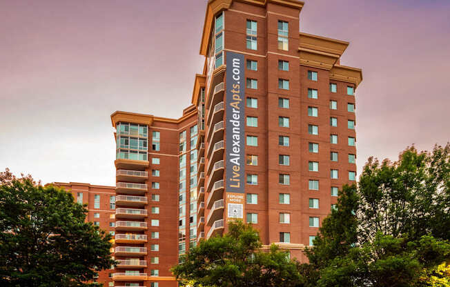 A large multi-story building with the text LiveAndLoveApartments.com on the side.