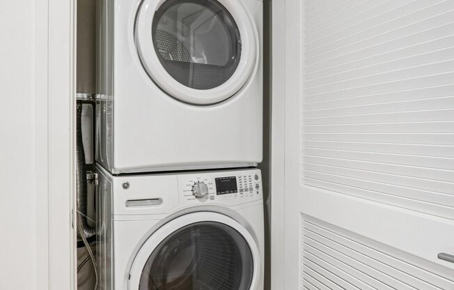 Front loading machines in small laundry room at Park77 Apartments, Massachusetts