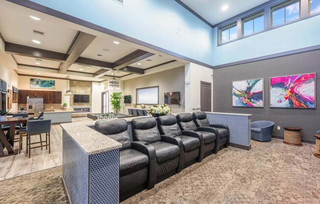 a large living room with a large couch and a table with chairs