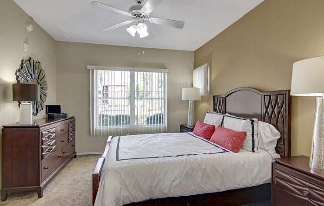 a bedroom with a large bed and a window
