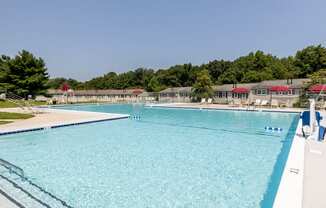 a large pool with a clear blue sky in the background