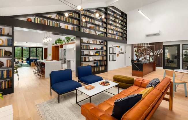 a living room filled with furniture and a library