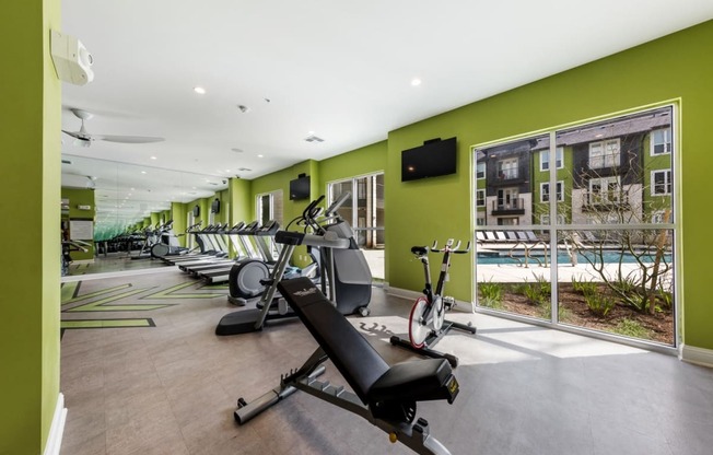 Cardio machine area overlooking the interior pool courtyard