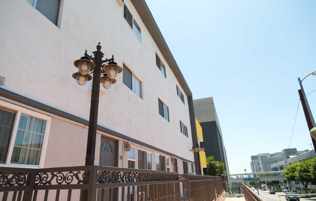 front of building with outdoor lighting and view of the street