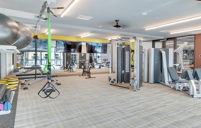 Expansive fitness center with free weights, TRX bands, and more!