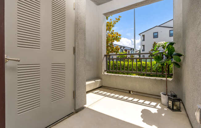A white door with a window in front of it.