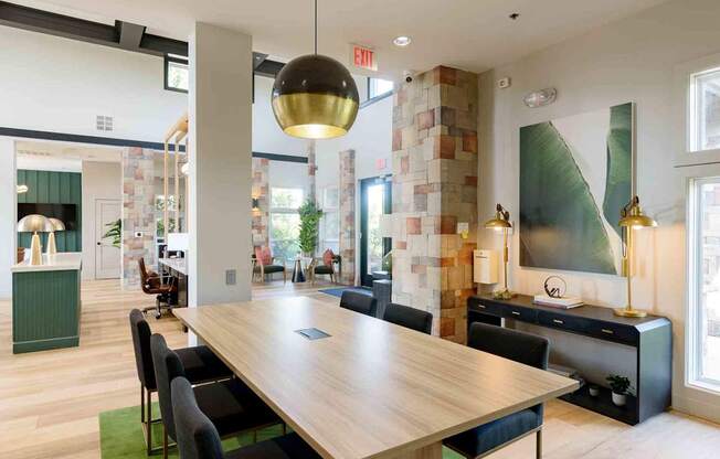 A conference room with a long table and chairs.