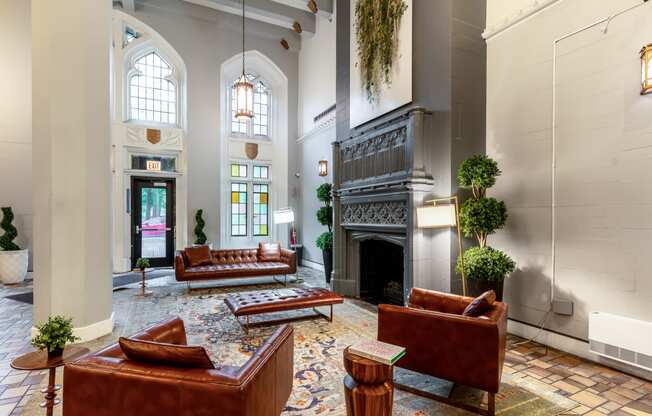a large lobby with couches and a fireplace