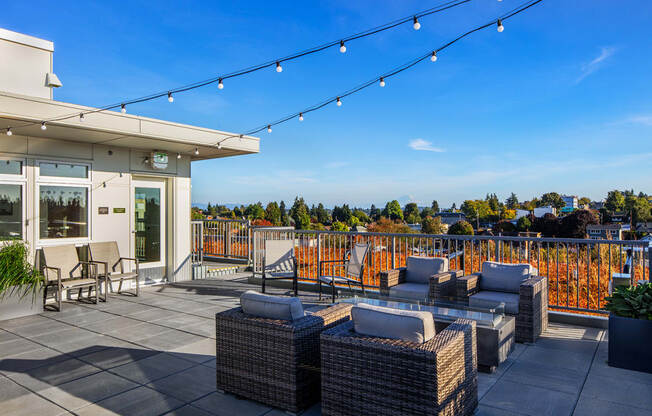 rooftop deck with lounge chairs and view