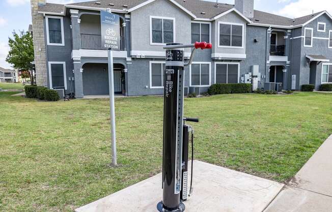 a parking meter in front of an apartment building  at Orion Prosper Lakes, Prosper, Texas