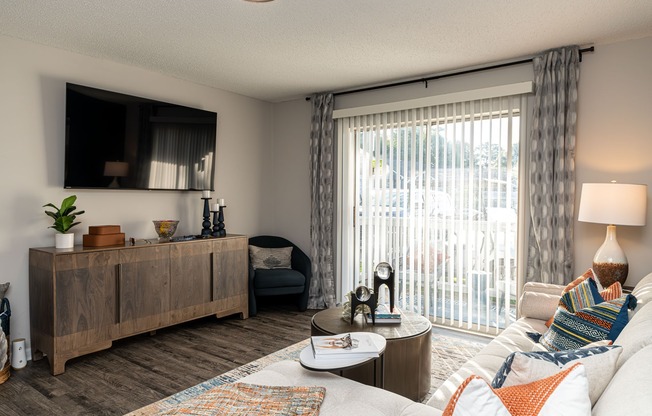 Spacious living room with hardwood-style flooring