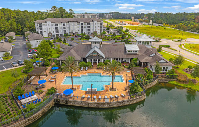 an aerial view of the resort with an outdoor swimming pool