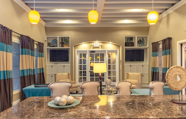 a living room filled with furniture and a large window