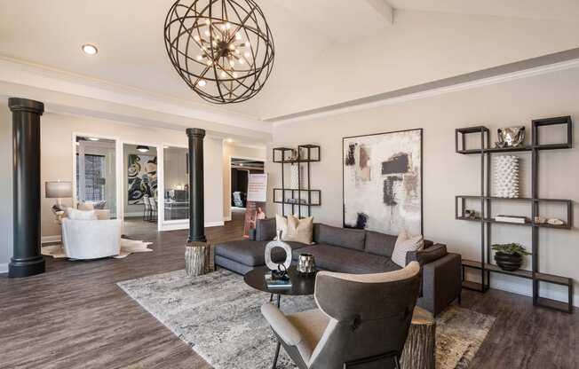 a living room with a couch and a table at Arlo Luxury homes Apartments, Little Rock, AR