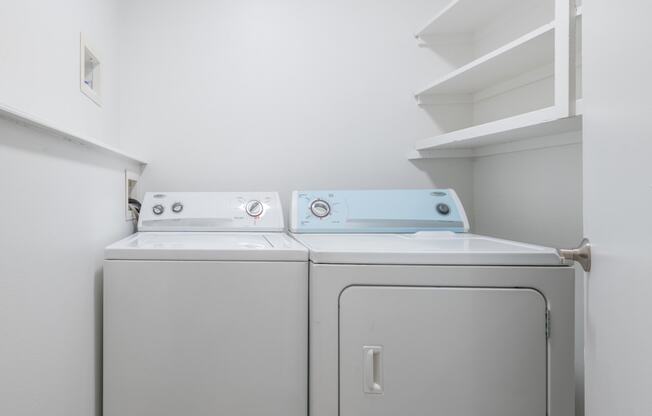 a laundry room with a washer and dryer
