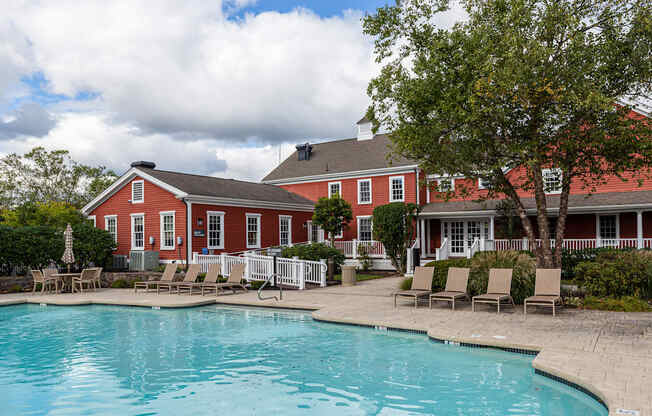 Orchards Apartments Marlborough ma apartment loft style apartments photo of  pool with lounge chairs and red siding clubhouse in background
