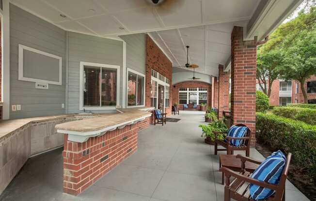 commons front porch with seating and a brick wall at Veranda at Centerfield, Texas