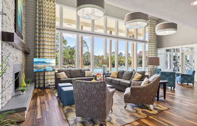 A living room with a fireplace and a large window.