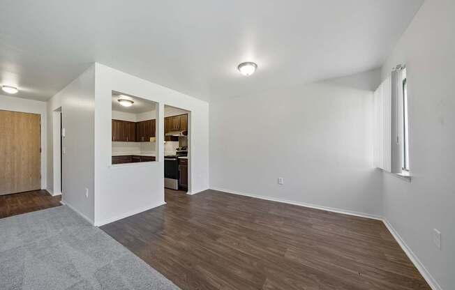 Open Living/Dining Room with natural light at Franklin River Apartments in Southfield, MIng Room with natural light at Franklin River Apartments in Southfield, MI