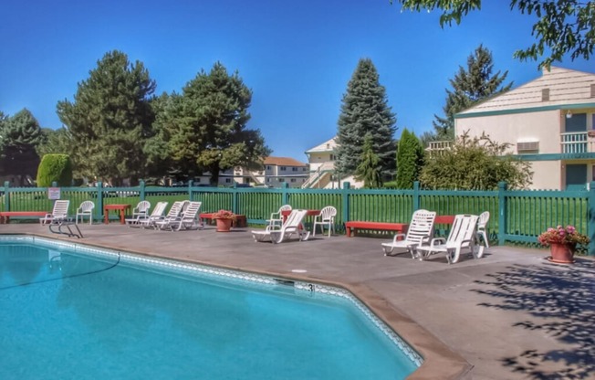 La Verde Apartments Pool Area with Lounge Chairs