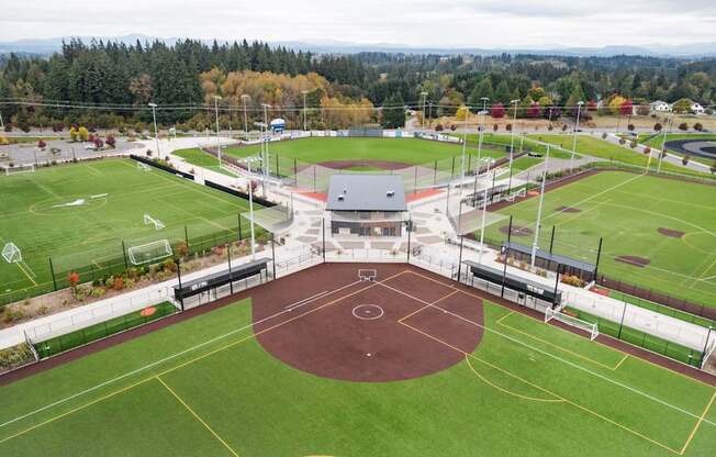 A sports complex with a basketball court in the center.
