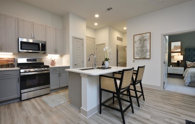 Kitchen with appliances at The Flats at West Alabama, Houston, TX, 77027