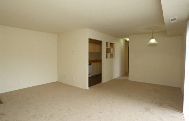 an empty living room and a kitchen in a house at Gates of West Bay, Norfolk, VA 23503