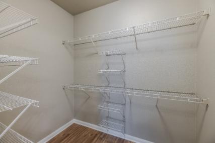 Empty white shelves in a room.