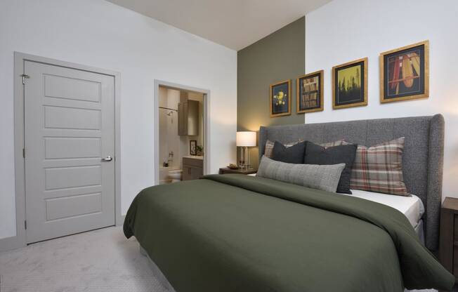 Bedroom with cozy bed and decor at The Flats at West Alabama, Houston, Texas