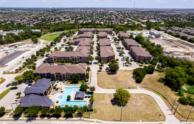 an aerial view of a neighborhood with houses and a swimming pool at Discovery at Craig Ranch, McKinney, TX