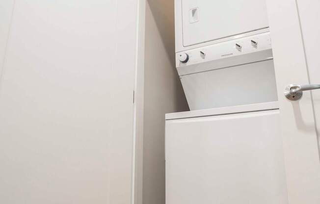a small laundry room with a washer and dryer in it