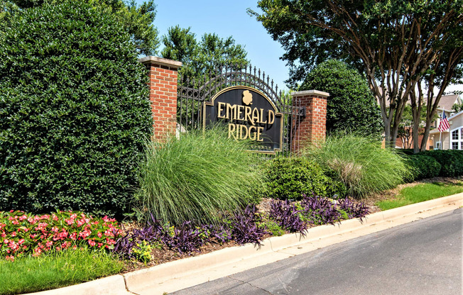 a sign for emerald ridge on the side of a street