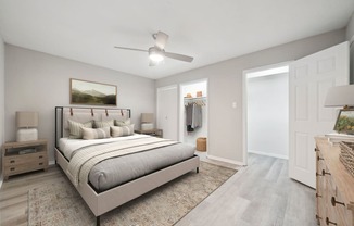 the master bedroom in a new apartment with a bed and closet