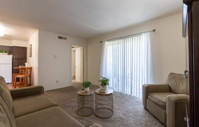 This is a photo of the living room of the 590 square foot 1 bedroom, 1 bath model apartment at The Biltmore Apartments located int he Vickery Meadow neighborhood of Dallas, TX.