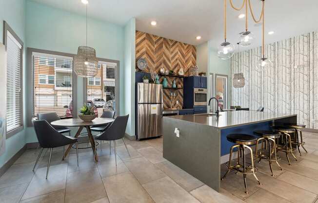 A kitchen with a dining table and chairs.