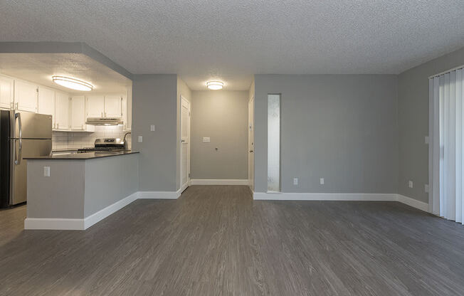 Living and dining area near kitchen l Vue at the Lake in Sacramento